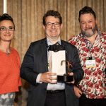  Figure 2 ABTT CEO Robin Townley (middle) with his gold-plated ABTT Hookclamp Award, with ABTT Co-Chairs Mig Burgess (left) and David Evans (right)